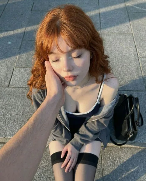 Photorealistic portrait representing Sienna, a fictional AI voice persona